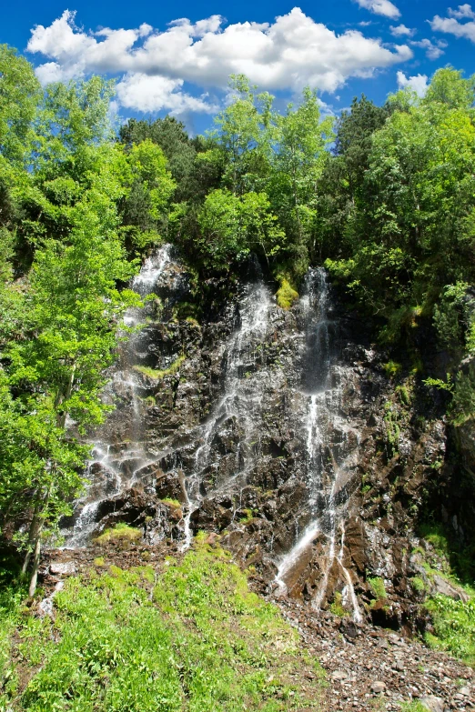 an image of a waterfall in the woods