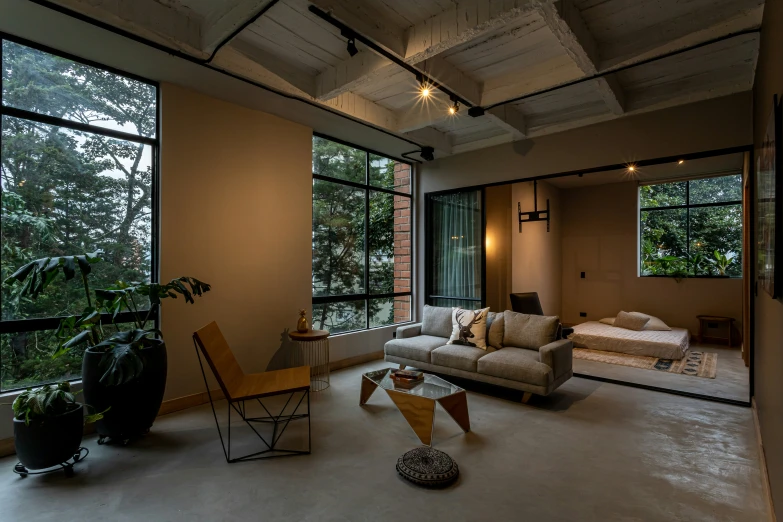 a large living room with a large glass window and wooden floors