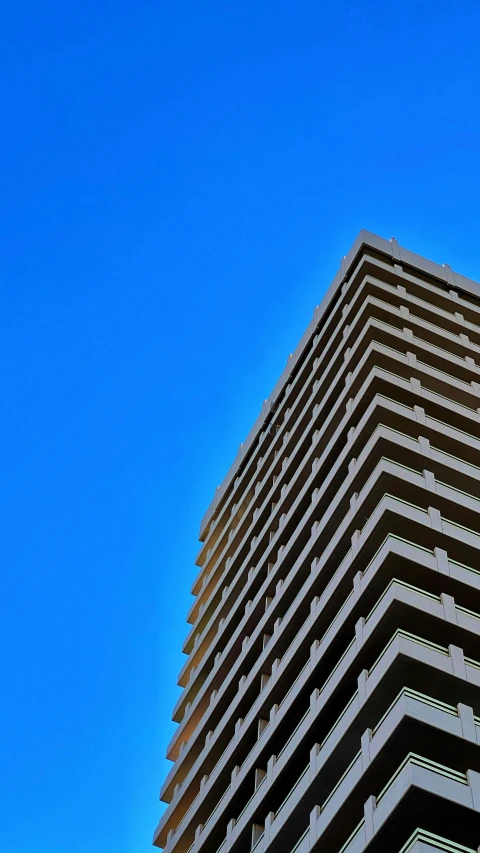 a picture of a very tall building in the blue sky