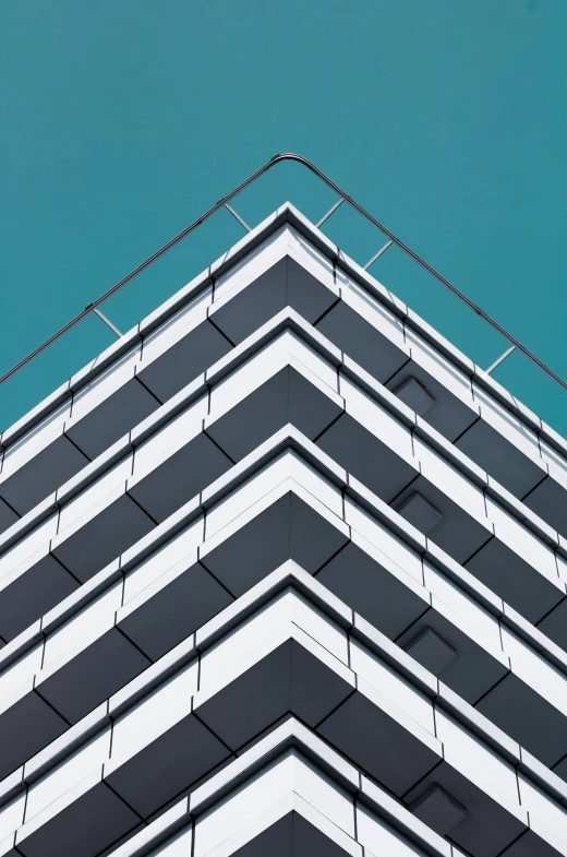 a building is standing out against a deep blue sky