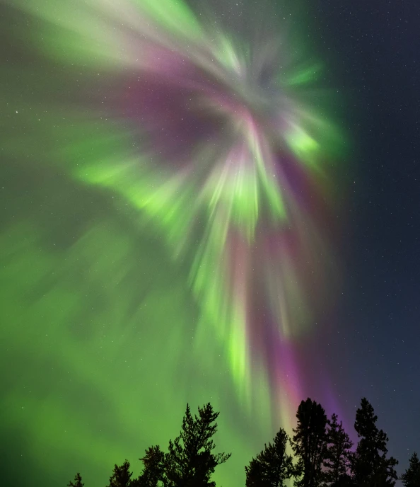 a very bright and green aurora bore in the night sky