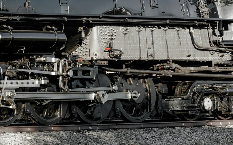 an old fashioned steam locomotive parked on tracks