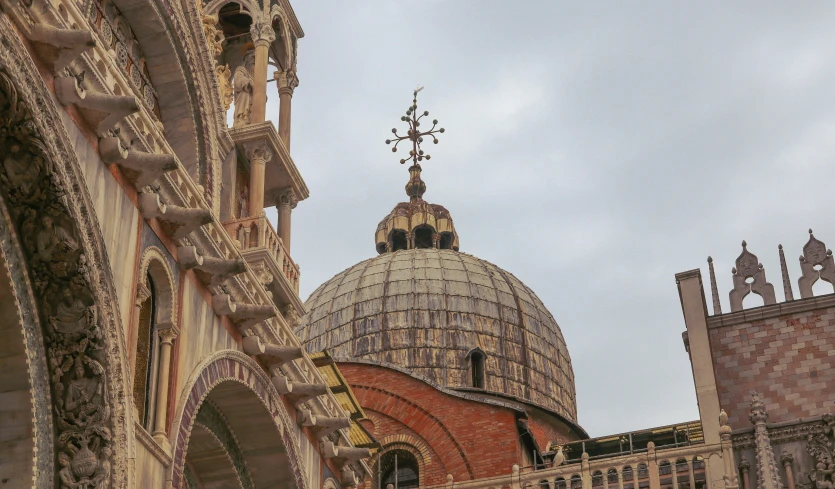 a dome on top of a building surrounded by buildings