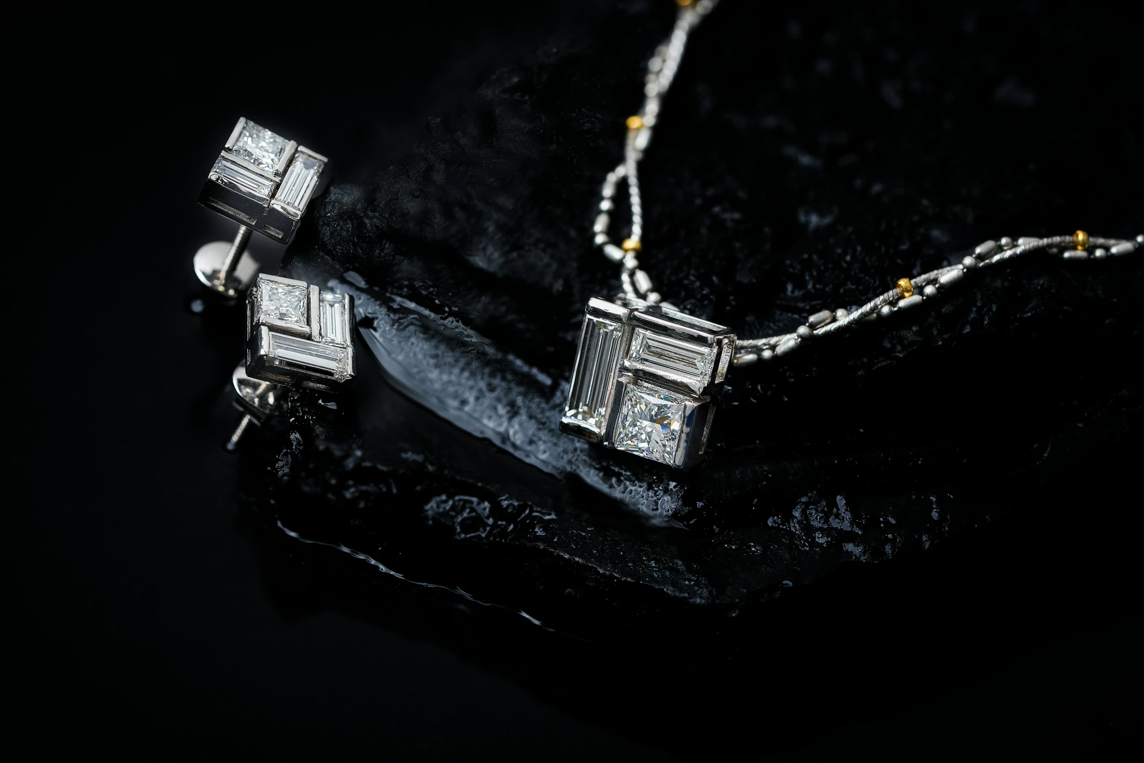 a pendant with square, rectangle and cube shaped designs