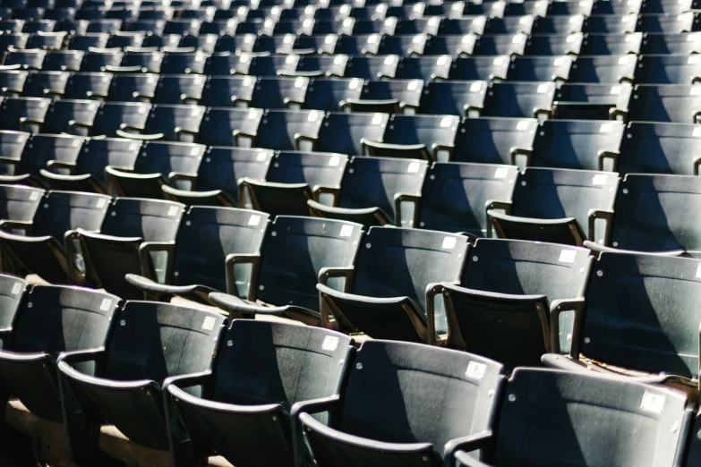 an empty stadium with blue seats