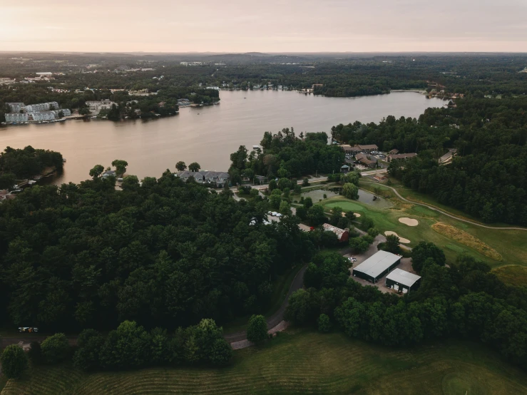 a rural area near water with lots of trees