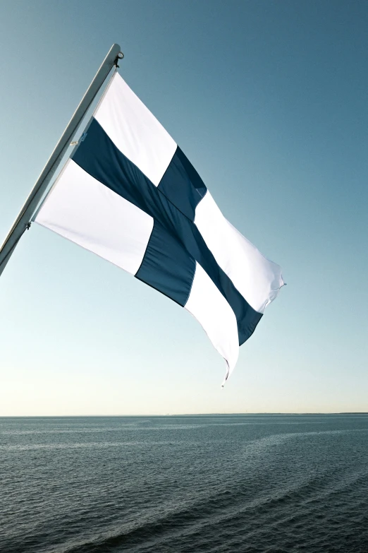 an image of a flag in the sky with waves