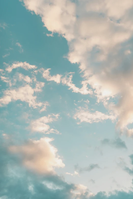 some white clouds and blue sky with light coming