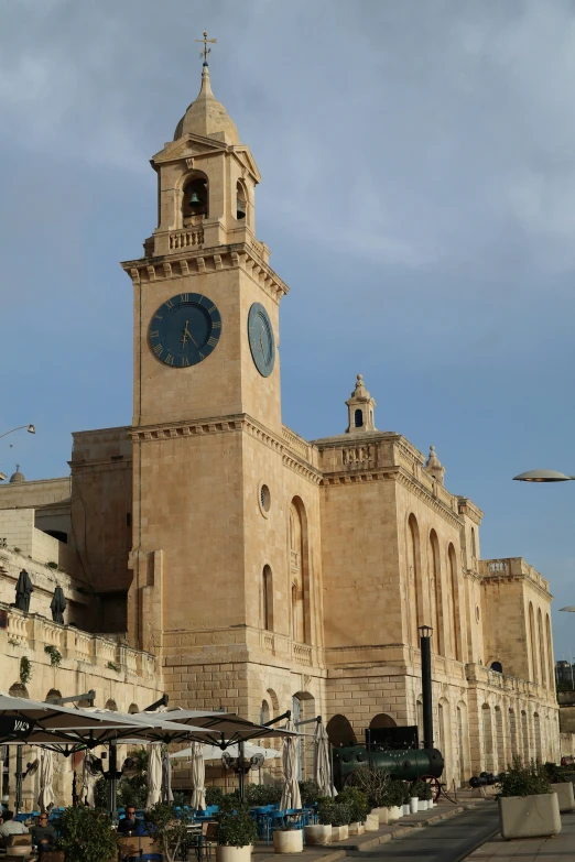 a big building with a blue clock on it's side