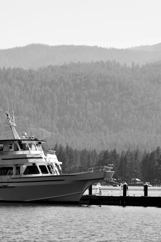 a boat docked at a dock near the water