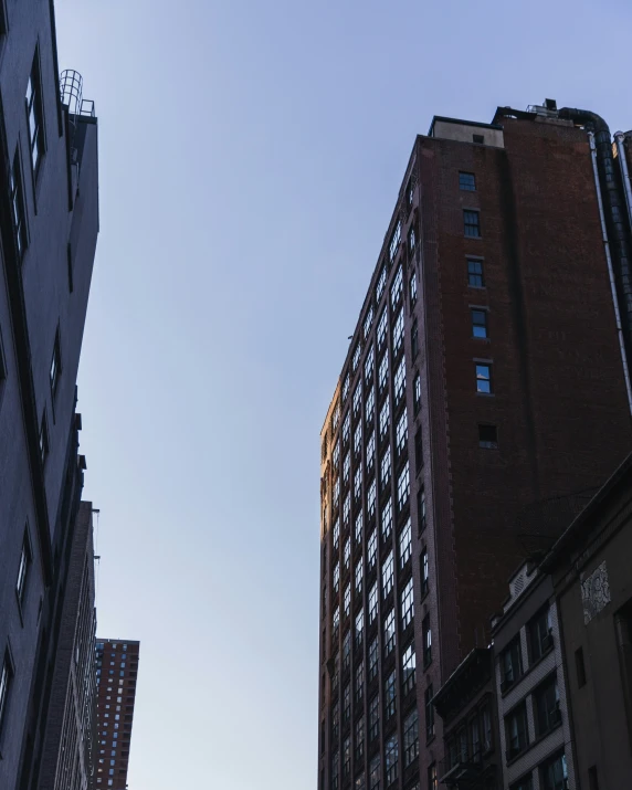 the view of some tall buildings from the ground