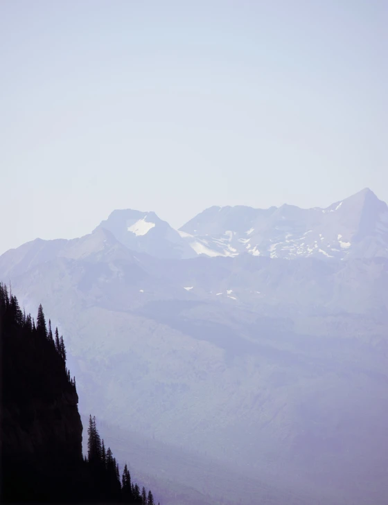 view of snowy mountains on a hazy day