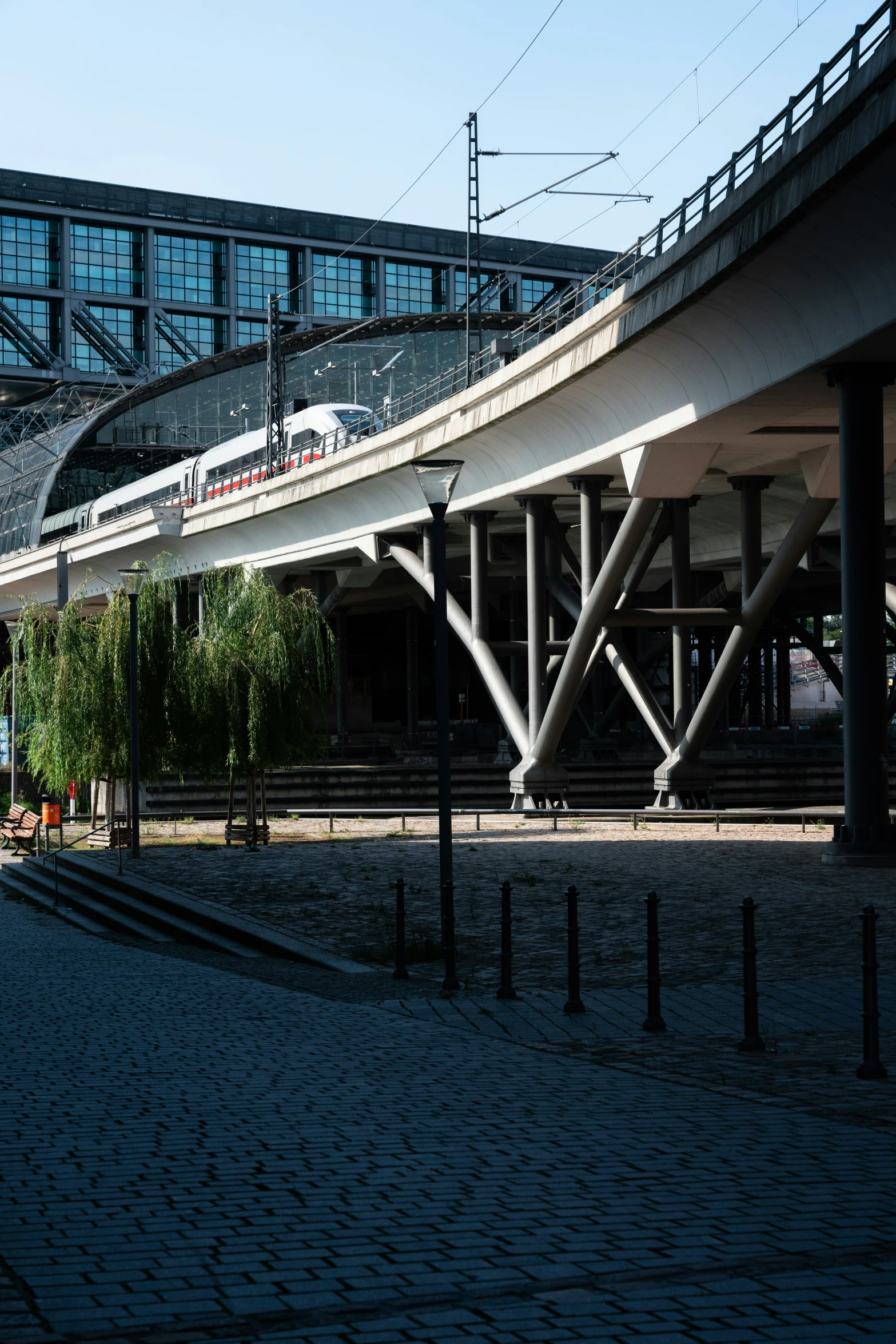 a train on top of train tracks in front of some buildings