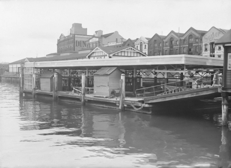 some people a boat house buildings water and buildings