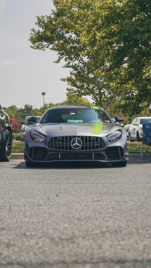 two sports cars parked next to each other at a race track