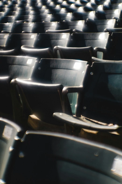 a stadium filled with chairs and black seats