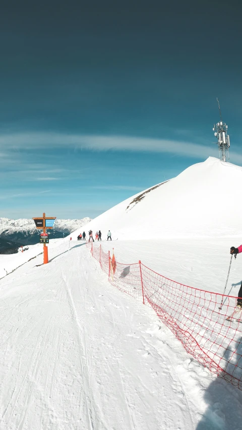 a cross country skier is traveling up the slope