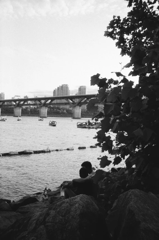 black and white pograph of boats in the water