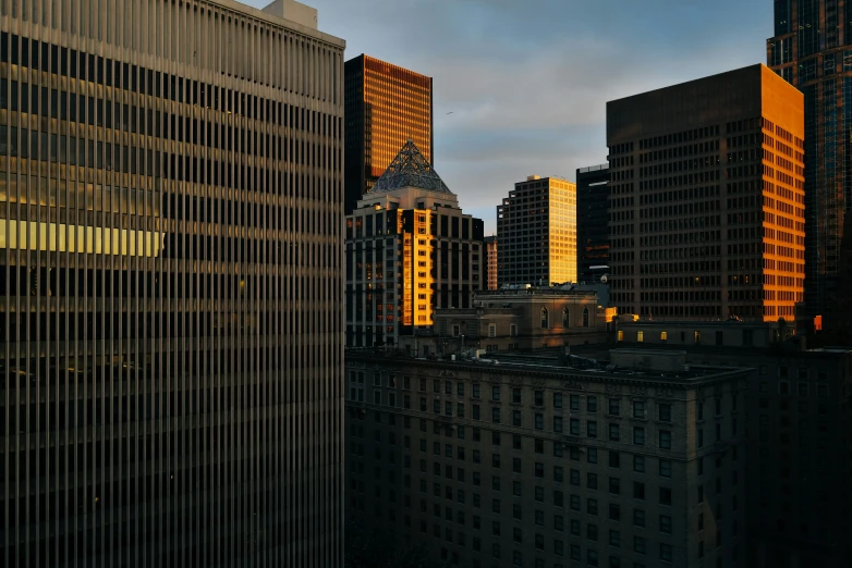 a view of a city from above in the sunset