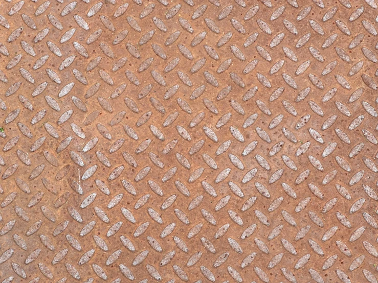 a brown diamond design surface with a grate pattern