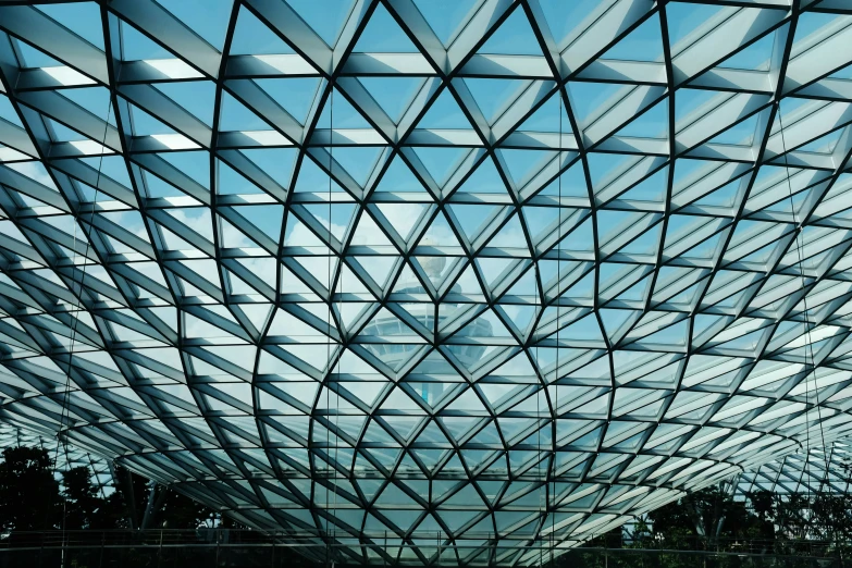 the inside of an architectural structure has a glass ceiling