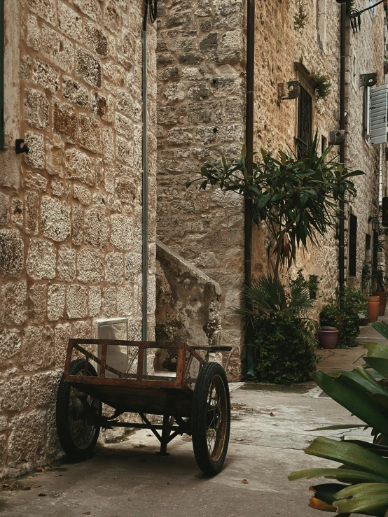 a cart parked in front of an old building