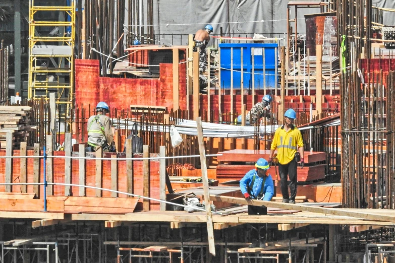 the workers are on construction at a building site