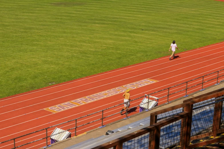 two men are on the track with their luggage