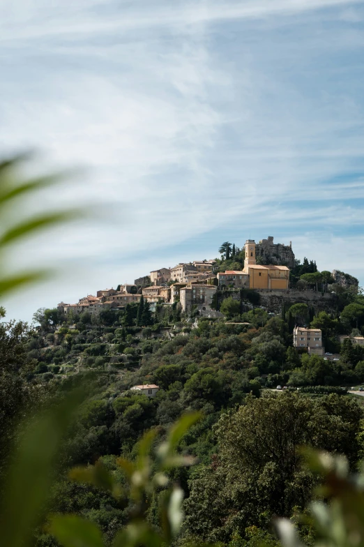 a hill with some buildings on top of it