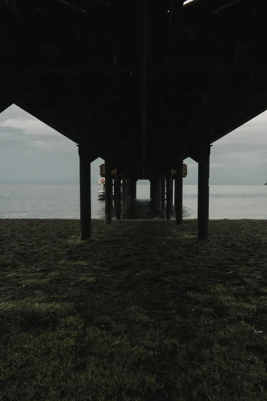 the view from underneath of a large pier