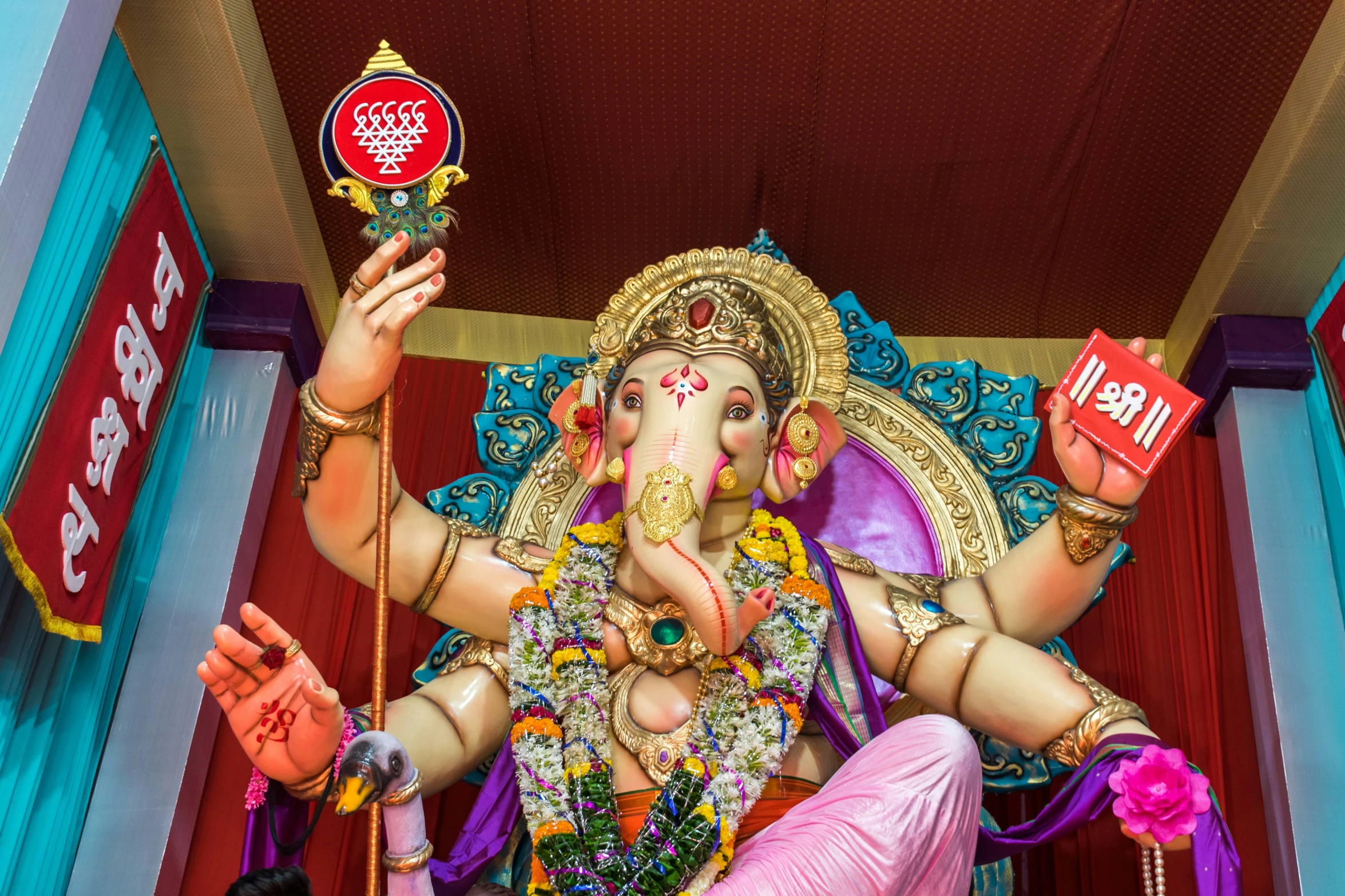 an elephant statue of a hindu god in front of a building