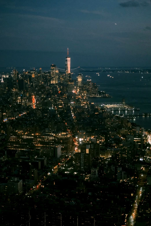 a view of a city at night with light from the buildings