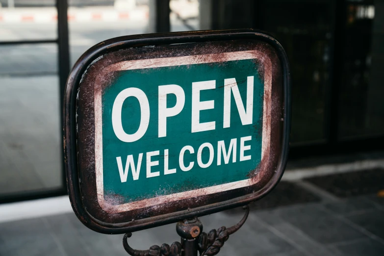 a sign advertising an open door is displayed