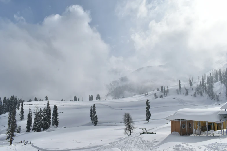 the ski slope is covered with thick snow