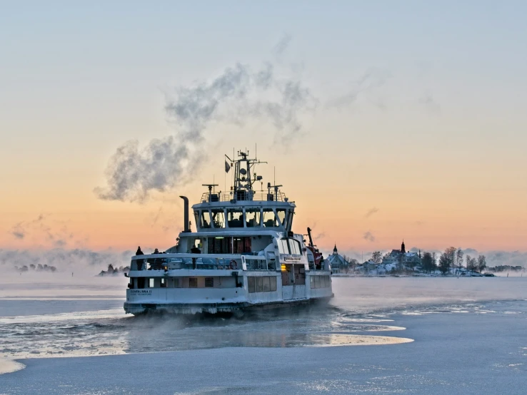 a large ship that has smoke coming out of it