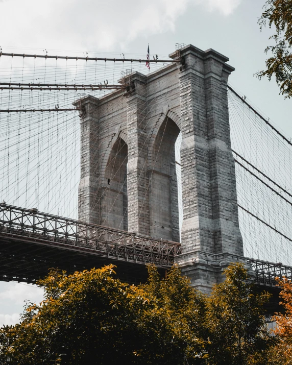 an image of a building with a bridge that looks like it has the brooklyn bridge on it