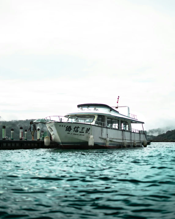 a large white boat docked at the dock