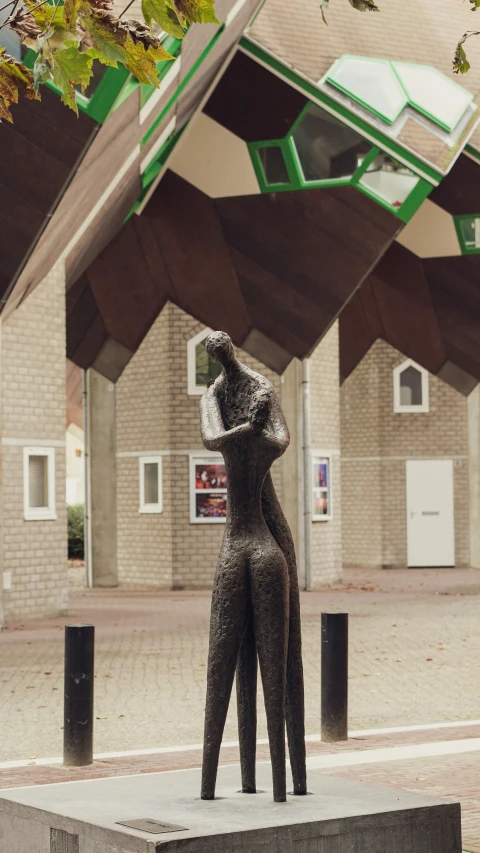 a statue is standing on the curb in front of a building