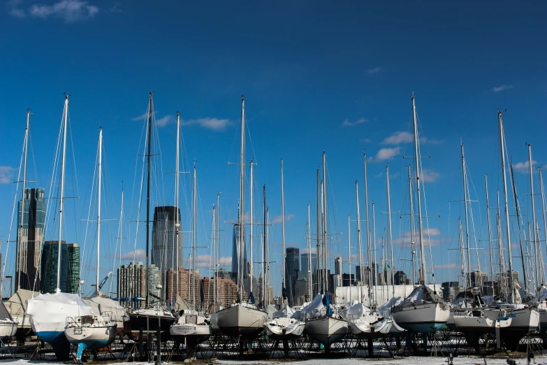 boats parked in a pile at a sail marina