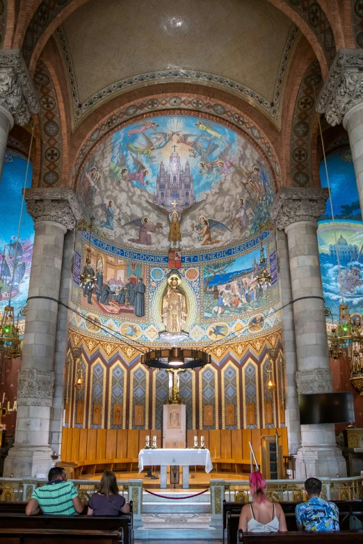 a couple of people that are sitting in a church