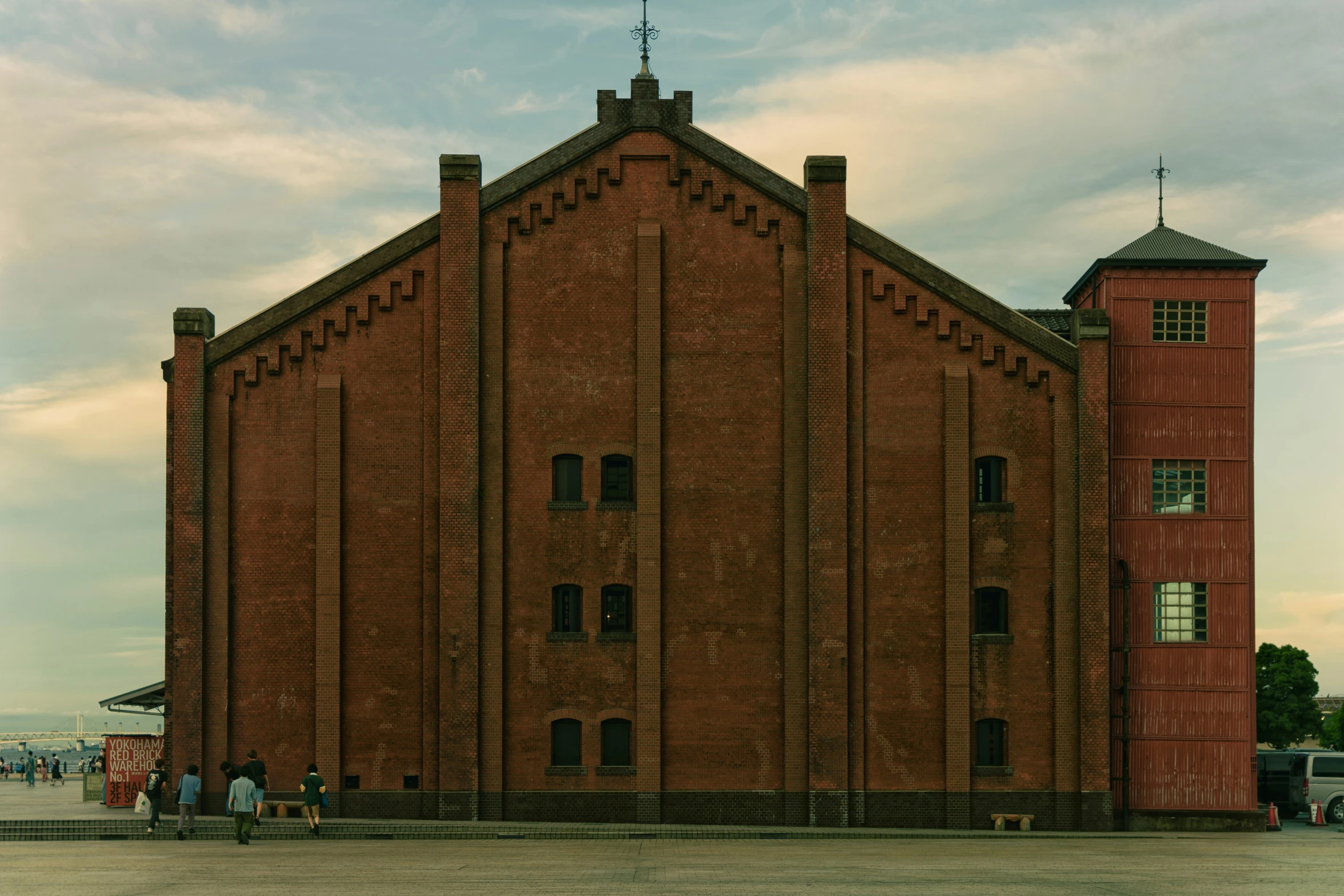 the two story brick building is located at the entrance