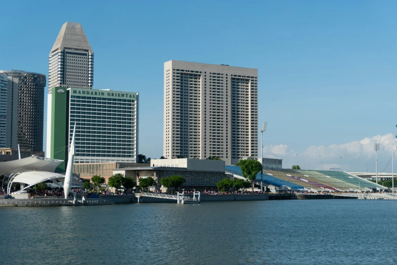 the city has a boat in front of it and buildings to the side