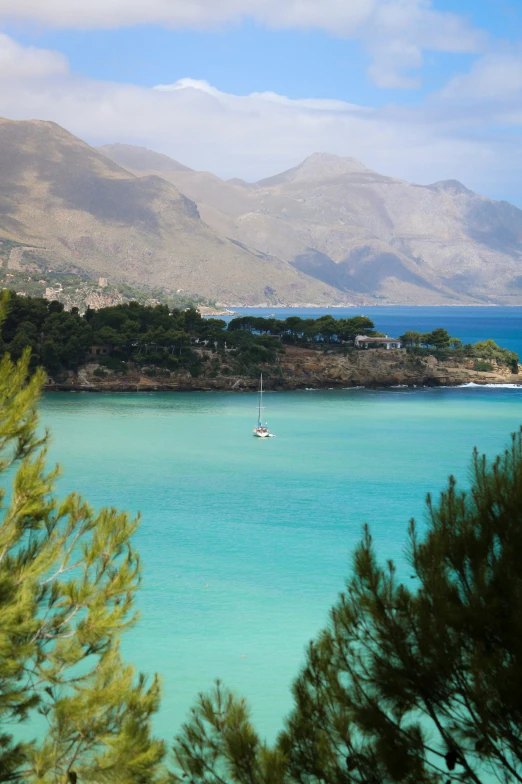 the view of boats floating in a calm ocean