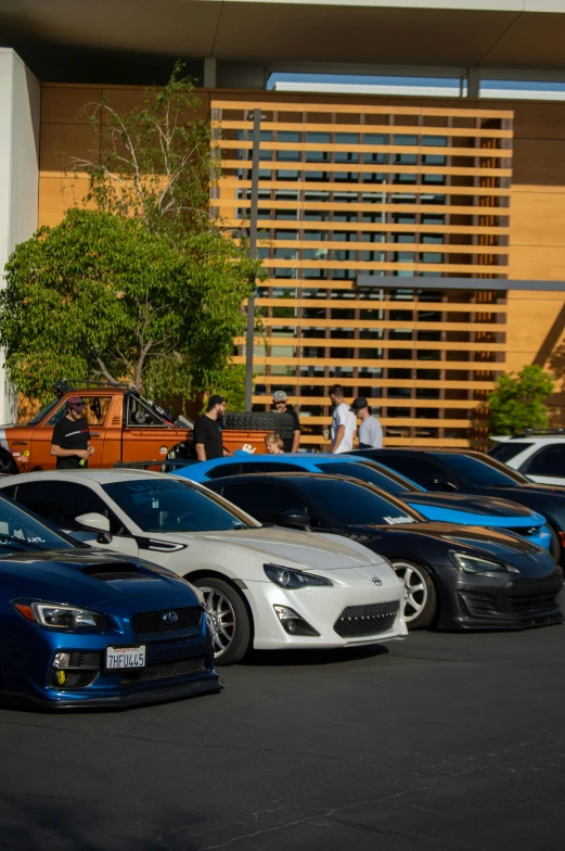 a row of exotic looking vehicles parked in a parking lot