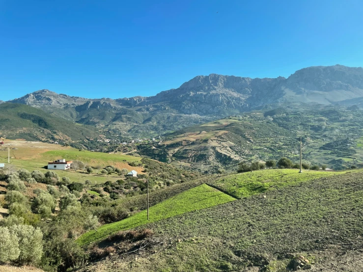 a view of a scenic green mountain range