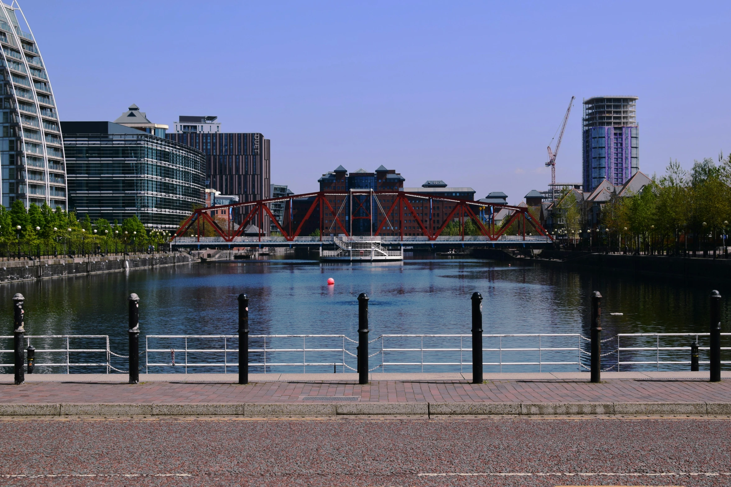 a view of an urban setting across a river