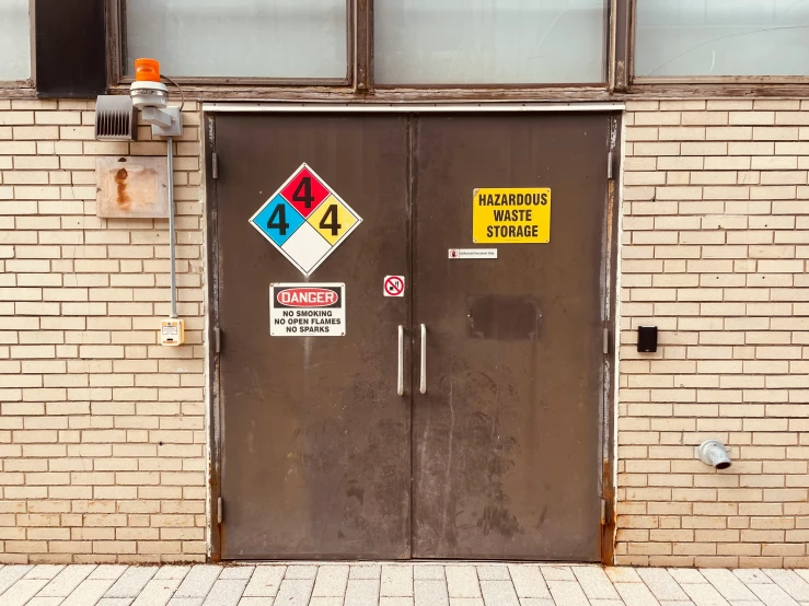 two signs and no parking are attached to doors