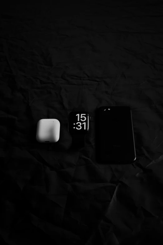 black and white pograph of cell phones lying side by side
