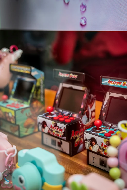 several different colorful toy machines sit on a table