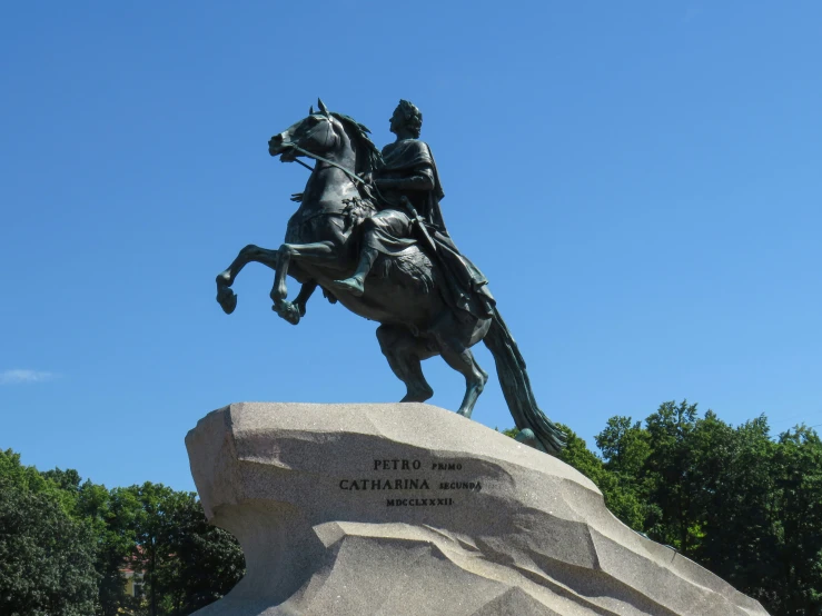 a statue of a man riding a horse